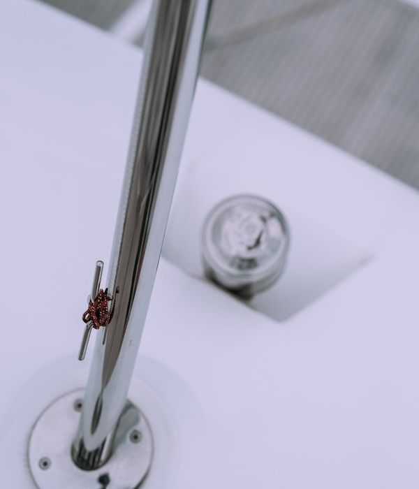 Abstract violet light beams reflecting on metallic surfaces