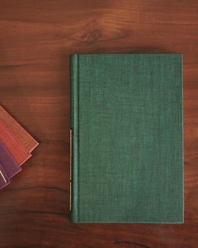 Guide book on dark surface with purple glow